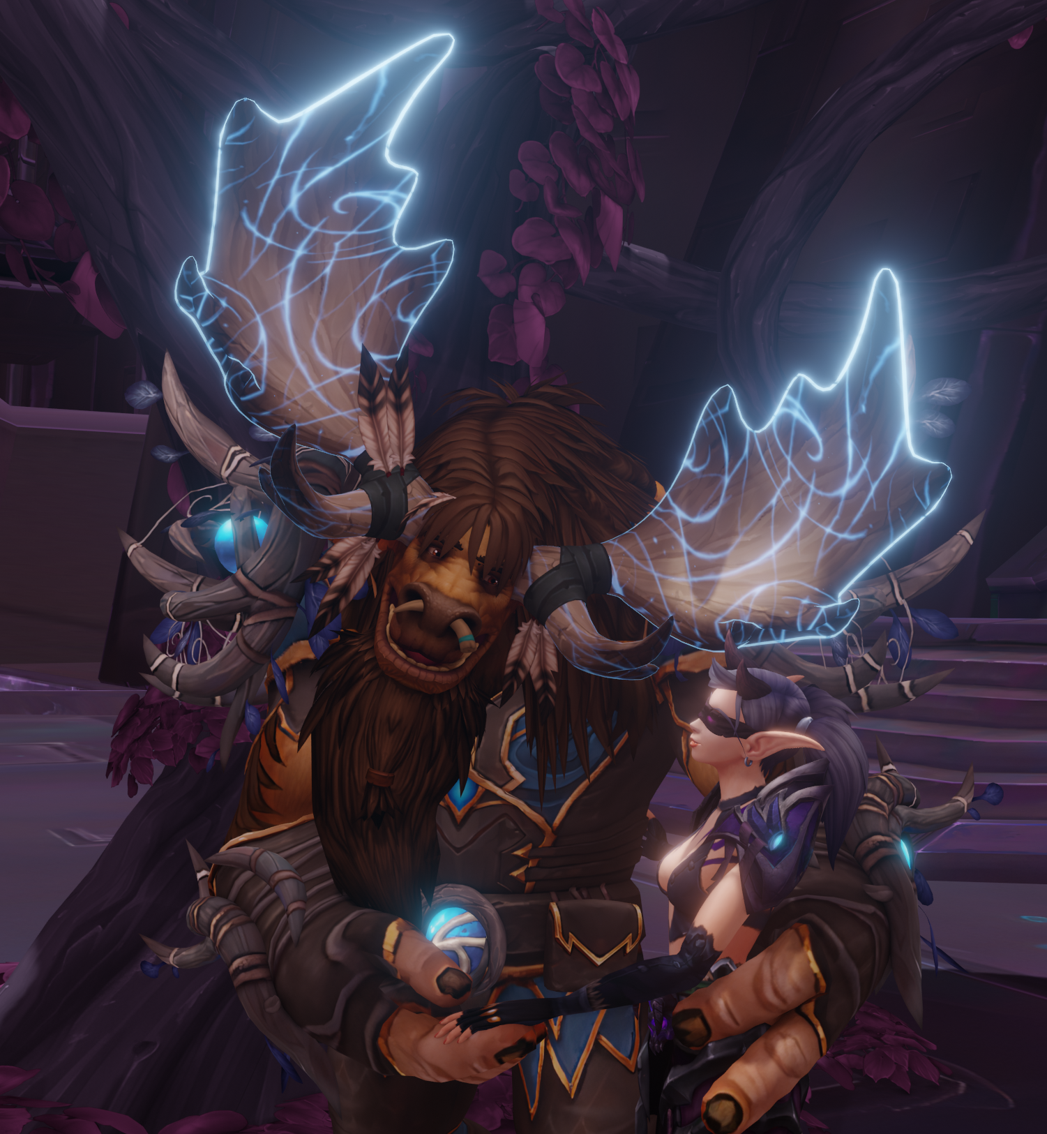 [A slightly different shot of the Highmountain Tauren holding the Blood Elf's hand. The scene is much brighter and displays blooming light sources.]